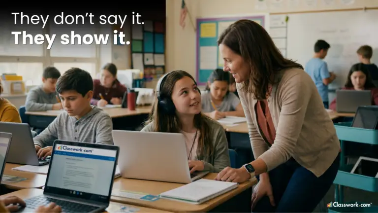 A teacher provides a 1-on-1 intervention for a middle school student using a laptop after receiving a signal from real-time classroom data.